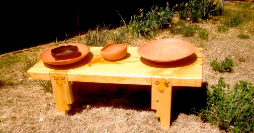 Bench and pots by Djann Hoffman